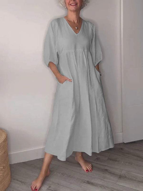 Eeva™ - Loose V-neck midi dress with pockets