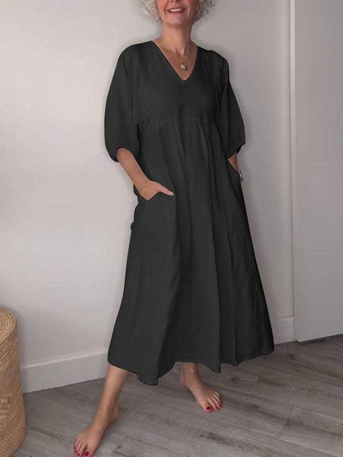 Eeva™ - Loose V-neck midi dress with pockets